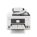 Front view of a white Canon MAXIFY GX4020 MegaTank printer showing ink levels and a color printout.